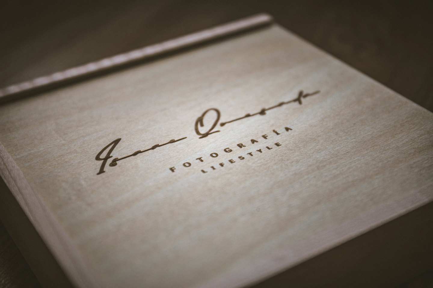 Wooden presentation box for a photographer with engraved text.